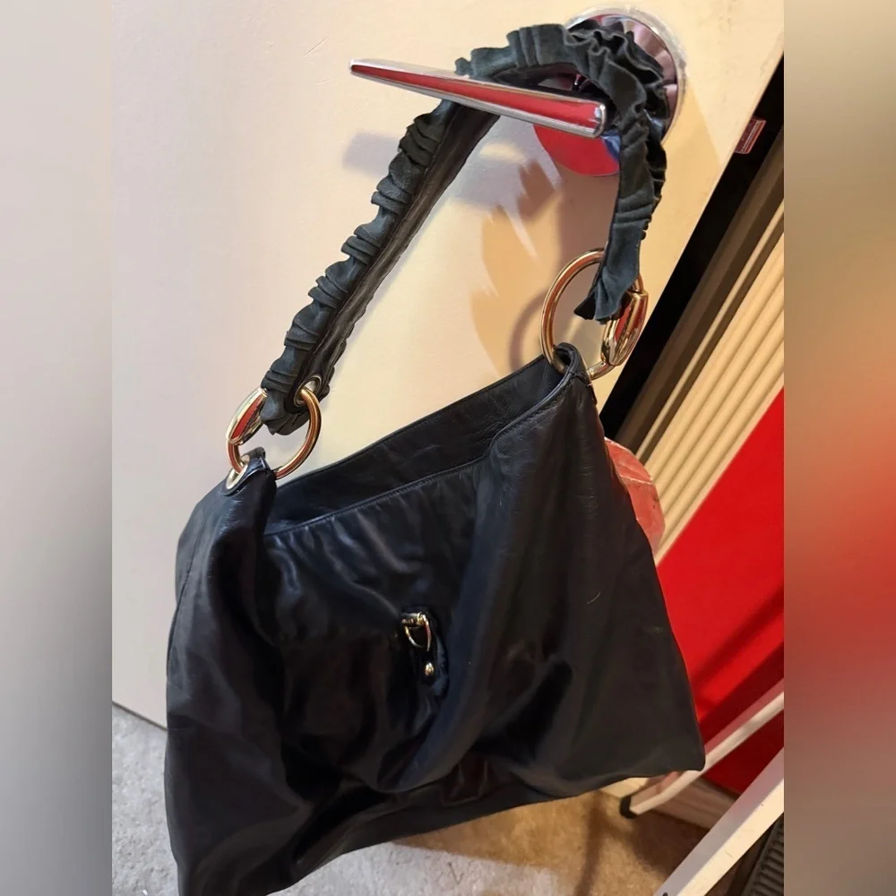 Gucci black leather hobo bag with gold detail